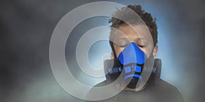 Young boy wearing gasmask, respirator portrait