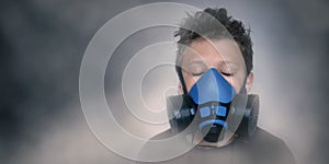 Young boy wearing gasmask, respirator portrait