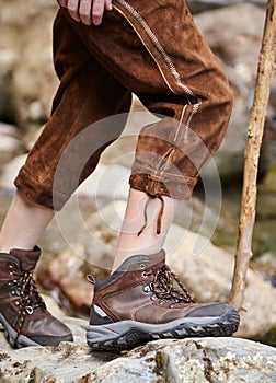 Young boy wearing lederhosen and hiking boots photo