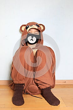 Young boy wearing mask, sleeping at home