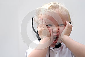 Young boy wearing phone headset