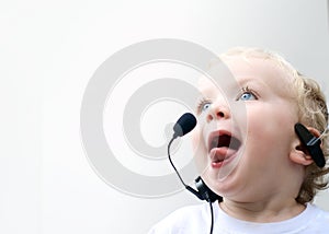 Young boy wearing phone headset