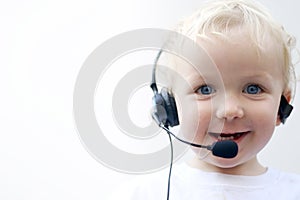 Young boy wearing phone headset