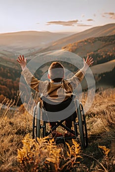 Young boy in wheelchair savoring the sunset with breathtaking mountain views in the background