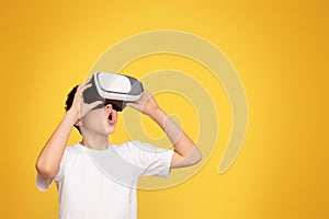 Young Boy in White T-shirt Holding Black and White Virtual Globe