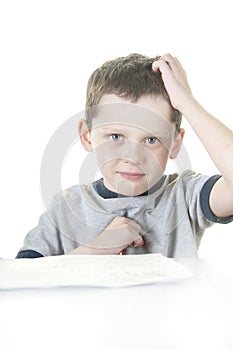 Young boy working at school