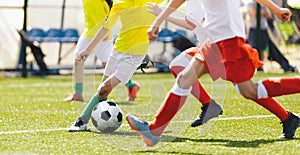 Young Boys Compete in Tournament Match in a Duel. Football Game on Summer Sunny Day