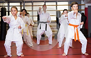 Young boys and girls in kimono doing kata