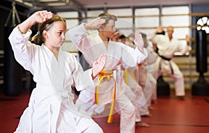 Young boys and girls in kimono doing kata