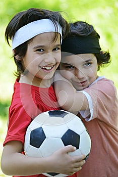 Young boys holding football