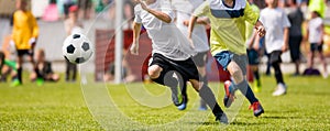 Young Boys Kicking Soccer Tournament Match on the Soccer Pitch