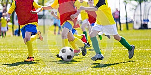 Young boys playing football soccer game