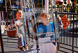 Children on Swings Amusement Park Fair Ride