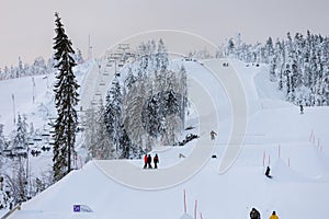 Young boys in a snow terrain park in Vuokatti Ski Resort in Finland.