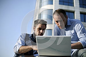 Young boys working on laptop