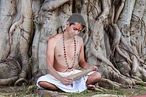 Young brahmin reads scripture