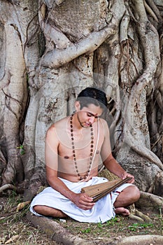 Young brahmin reads scripture