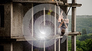 Young and brave man balancing on a slackline