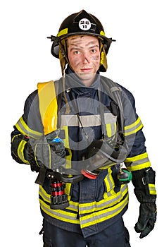 Young brave man in uniform and hardhat of firefighter with fire hose