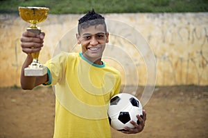 Young Brazilian Football Soccer Player Holding Trophy