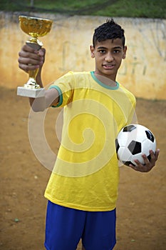 Young Brazilian Football Soccer Player Holding Trophy