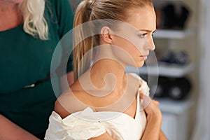 Getting ready for the big day. A young bride getting her hair done before the wedding.