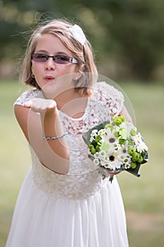 Young bride girl sending kiss