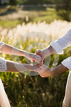 Young Bride and Groom couple in garden. Love and tenderness