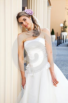 Young Bride Leaning Against a Pillar