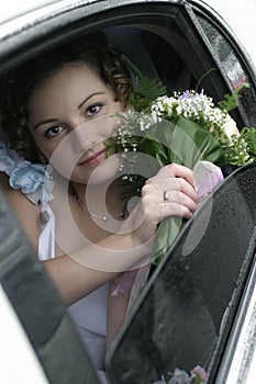 Young bride in a limousine