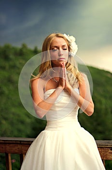 Young bride praying