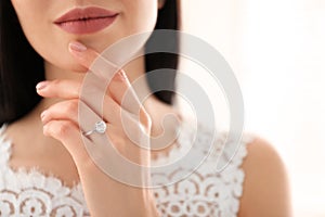 Young bride wearing beautiful engagement ring