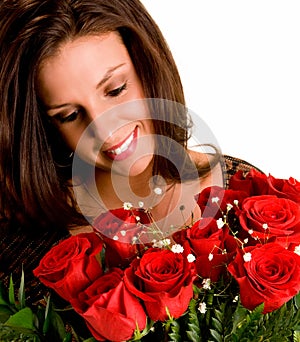 Young Brunette Admiring her Roses photo