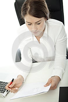 Young brunette business woman thinking