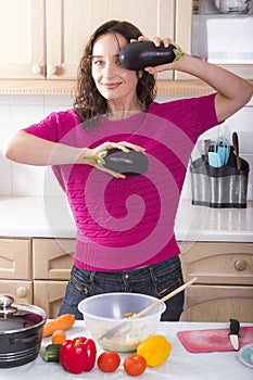 Young brunette cooking vegetables at home