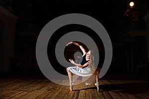 Young brunette dancer girl on stage