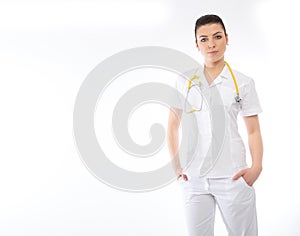 Young brunette doctor in white wearing and stethoscope