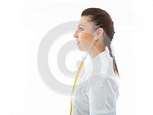 Young brunette doctor in white wearing and stethoscope