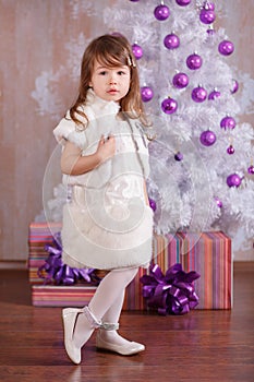 Young brunette dolly lady girl stylish dressed in cosy evening official white dress fur jacket strap shoes smiling posing in studi
