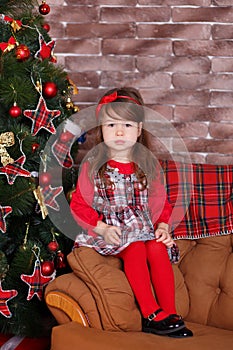 Young brunette dolly lady girl stylish dressed in red dress costume chequers check tartan skirt strap shoes smiling posing sitting