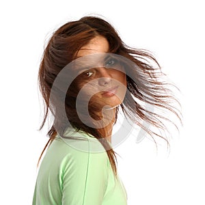 Young brunette girl with a hairdress in movement