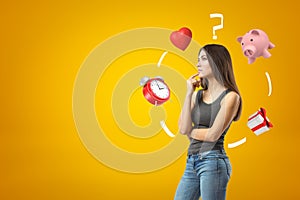 Young brunette girl wearing casual jeans and t-shirt thinkings with alarm clock, red heart, question mark, piggy bank