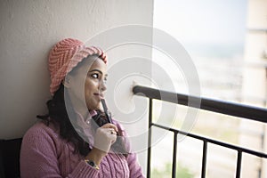 Young brunette Indian Bengali woman in winter garments