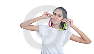 Young brunette indian girl holding red and green pepper chili with her fingers isolated on white background