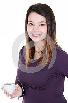 Young brunette pretty woman drinking coffee in a mug