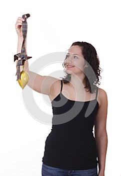 Young Brunette Smiling at a Christmas Ornament