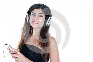 young brunette smiling woman listening music using mobile phone aside copy space white background