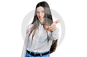 Young brunette teenager wearing business white shirt smiling friendly offering handshake as greeting and welcoming