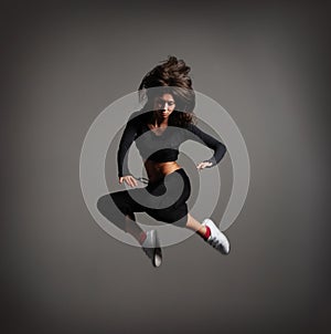 A young brunette woman in a beautiful jump