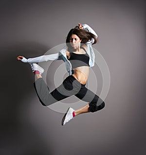 A young brunette woman in a beautiful jump